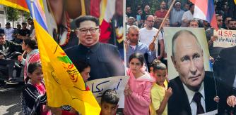 Banderas amarillas de Al Fatah, verdes de Hamas y rusas, y retratos de Putin y Kim Jong Un en una marcha en Hebrón el 20 de octubre