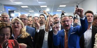 The co-leaders of the far-right Alternative for Germany (AfD) party Alice Weidel (C) and Tino Chrupalla (2ndR) and AfD member Beatrix von Storch (L) and European elections candidate Rene Aust (R) cheer after first exit polls during the Electoral evening of the farright Alternative für Deutschland (AfD) after the European Parliament elections in Berlin, on June 9, 2024. (Photo by RALF HIRSCHBERGER / AFP)