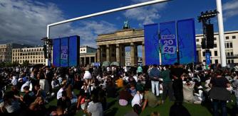People visit the official Fan Mile on 17th June Street, close to the Brandenburg Gate, during its pre-opening in Berlin, Germany, June 12, 2024. REUTERS/Lisi Niesner