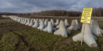 Concrete anti-tank barriers are pictured as Poland's Prime Minister inspects the first completed section of