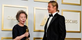 Brad Pitt poses with Yuh-Jung Youn, winner of the award for Best Actress in a Supporting Role for 