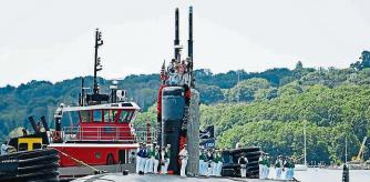 The U.S. Navy Los Angeles-class attack submarine USS San Juan (SSN 751) returns to the Navy submarine base in Groton, Conn., Tuesday, Aug. 24, 2021, following a nearly 8-month deployment. The San Juan, commissioned in 1988, is the second U.S. warship named for the capital of Puerto Rico. (Sean D. Elliot/The Day via AP)