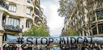 December 12, 2017 - Barcelona, Catalonia, Spain - Several activists seen showing an inflatable globe with the text ''STOP MIDCAT'' a catalan gas pipeline..Coinciding with the Summit in Paris, One Planet, organized by Emmanuel Macron, a small group of activists have been concentrated outside the headquarters of the European Union in Barcelona to demand the abandonment of investments in non-sustainable energy. Together with the World Bank (WB), other financial institutions and investment funds have announced at the Summit One Planet that they will not fund, except in the exceptional situation of poor countries, projects of exploration and extraction of oil and gas, in favor of the Green and renewable energy economy.