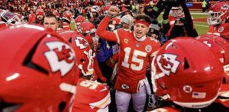 FILE — Kansas City Chiefs quarterback Patrick Mahomes (15) talks to teammates before the NFL AFC championship football game against the Cincinnati Bengals on Jan. 29, 2023, in Kansas City, Mo. (AP Photo/Charlie Riedel, File)