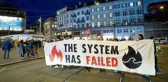 People demonstrate against the buying of Swiss bank Credit Suisse by UBS, in Zurich, Switzerland March 20, 2023. REUTERS/Denis Balibouse