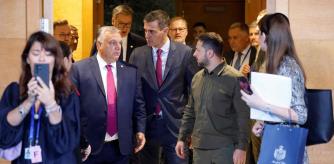 Ukraine's President Volodymyr Zelensky (R) walks with Hungary's Prime Minister Viktor Orban (L) next to Spain's Prime Minister Pedro Sanchez before the start of a plenary session of the European Political Community summit at the Palacio de Congreso in Granada, southern Spain on October 5, 2023. Europe's quest to build a common geopolitical purpose brought four dozen of its leaders to Granada, but its credibility suffered a blow when the Azerbaijani president stayed away. (Photo by Ludovic MARIN / AFP)