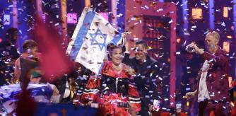 FILE - In this May 12, 2018 file photo, Netta Barzilai from Israel celebrates after winning the Eurovision song contest in Lisbon, Portugal. The Eurovision Song Contest has announced that next year's competition will be held in Tel Aviv. The government initially insisted on holding the popular event in Jerusalem. But following a backlash over the U.S. recognition of Jerusalem as its capital and a subsequent fear of boycotts it dropped the demand. (AP Photo/Armando Franca, File)
