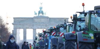 BERLIN, GERMANY - JANUARY 08: Tractors of protesting farmers line Strasse des 17. Juni street in front of the Brandenburg Gate on the first day of a week of protests on January 08, 2024 in Berlin, Germany. Farmers are protesting across Germany this week against proposed government measures that would reduce federal benefits for the agricultural sector. While the coalition government recently stepped back from some of the measures, including a proposed taxation of agricultural vehicles and cutting agricultural fuel subsidies, farmers have vowed to press on with their protests in order to stop any measures from being enacted at all. The government is seeking to save EUR 100 million in its agriculture budget. (Photo by Sean Gallup/Getty Images)