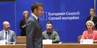 French President Emmanuel Macron, center, arrives for a round table meeting during an EU summit in Brussels, Thursday, June 27, 2024. European Union leaders are expected on Thursday to discuss the next EU top jobs, as well as the situation in the Middle East and Ukraine, security and defence and EU competitiveness. From left, European Council President Charles Michel, Ukraine's President Volodymyr Zelenskyy and European Commission President Ursula von der Leyen. (Olivier Hoslet, Pool Photo via AP)