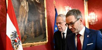Austria's President Alexander van der Bellen (L) welcomes the leader of the far-right Freedom party (FPOe) Herbert Kickl for talks on January 6, 2025 at the presidential Hofburg Palace in Vienna, Austria. Austria's conservatives of the People's Party (OeVP) said on January 5, 2025 they were ready to start negotiations with the far-right Freedom party (FPOe) to form a new government, a policy U-turn after coalition talks with two centrist parties failed. (Photo by Joe Klamar / AFP)