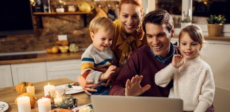 Happy parents and kids using computer and waving while making video call berofe Thanksgiving dinner in dining room.  (Happy parents and kids using computer and waving while making video call berofe Thanksgiving dinner in dining room. , ASCII, 117 comp