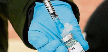 (FILES) In this file photo Registered Nurse Emily Enos loads the Moderna Covid-19 vaccine into a syringe ahead of the distribution of vaccines to seniors above the age of 65 who are experiencing homelessness at the Los Angeles Mission, in the Skid Row area of Downtown Los Angeles, California on February 10, 2021, as the fight against the coronavirus pandemic continues. - The United Nations on February 17, 2021 led calls for a coordinated global effort to vaccinate against Covid-19, warning that gaping inequities in initial efforts put the whole planet at risk.Foreign ministers met virtually for a first-ever UN Security Council session on vaccinations called by current chair Britain, which said the world had a 