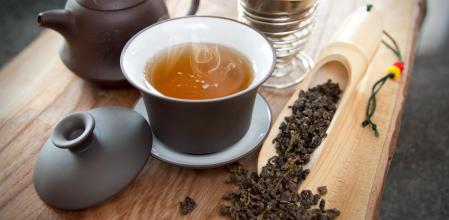 Cup of oolong tea and accessories