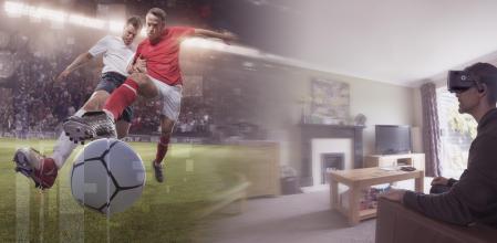 Conceptual image of a man in his 40s wearing a VR headset, sitting on a sofa in a living room during the day watching a soccer game in virtual reality. The footballers are in tackling in mid air during a soccer match in a floodlit outdoor stadium. With intentional distortions.