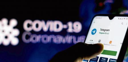 BRAZIL - 2020/04/08: In this photo illustration the Telegram logo seen displayed on a smartphone with a computer model of the COVID-19 coronavirus in the background. (Photo Illustration by Rafael Henrique/SOPA Images/LightRocket via Getty Images)