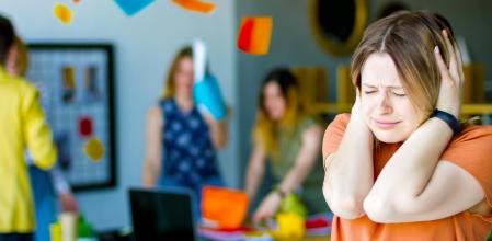 Women office worker stuff hold her head have stress headache panic at work need help Full chaos background crazy people manager quarrel argue debate throw paper at business meeting they failed project