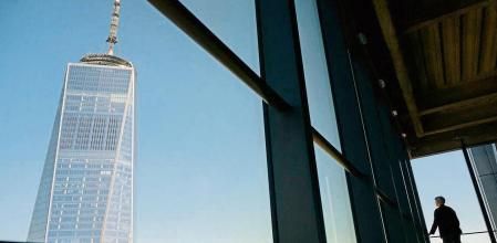 One World Trade Center architect Kenneth Lewis (R) looks at 
