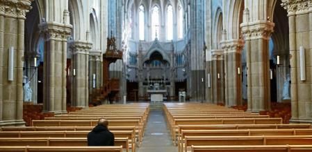 A man prays inside the Saint-Martin church in Vertou near Nantes, France, October 5, 2021. REUTERS/Stephane Mahe