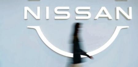 The Nissan Motor Co. logo in a showroom at the company's global headquarters in Yokohama, Japan, on Tuesday, Nov. 2, 2021. As Japan's biggest carmakers report earnings over the next week, strong demand for vehicles is fueling higher profits that will help offset lower sales volumes caused by parts shortages and production cuts. Photographer: Kiyoshi Ota/Bloomberg
