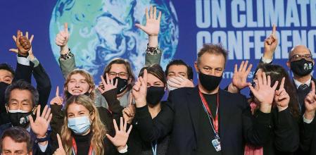 Delegates pose for a picture during the UN Climate Change Conference (COP26) in Glasgow, Scotland, Britain November 13, 2021. REUTERS/Yves Herman