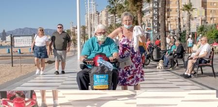 BENIDORM, SPAIN - NOVEMBER 07: A man drives his mobility scooter along the promenada of Levante beach on November 07, 2021 in Benidorm, Spain. The number of British tourists in Benidorm, a city that has long catered to visitors from the UK, has steadily risen since Westminster eased travel rules at the beginning of October, dropping pre-flight Covid-19 tests for vaccinated travelers. Local authorities in Benidorm say around a quarter of tourists are now from the UK, down from 45% pre-pandemic, but enough to breathe life into its famous 