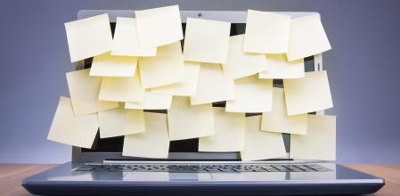 Coloured post-it notes covering laptop screen