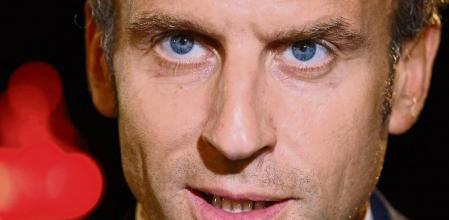 (FILES) This file photo taken on October 5, 2021 shows France's President Emmanuel Macron arriving for the EU-Western Balkans summit at Brdo Castle in Kranj. - President Emmanuel Macron on January 5, 2022 warned people in France not yet vaccinated against Covid-19 that he would cause them trouble by limiting access to key aspects of life in the country. (Photo by Ludovic MARIN / AFP)