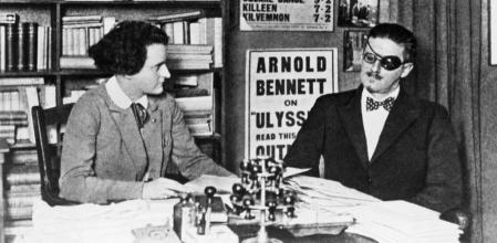 Author of Ulysses James Joyce and his publisher Sylvia Beach in an office in Paris.