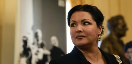 Russian soprano Anna Netrebko answers reporters' questions prior to the start of a news conference to present Giuseppe Verdi's 'Macbeth', directed by Italian conductor Riccardo Chailly, who will open the opera season at the La Scala opera house next, Dec.7, 201, in Milan, Italy, Monday, Nov. 29, 2021. (AP Photo/Luca Bruno)