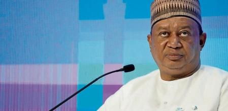 FILE - OPEC Secretary-General Mohammad Sanusi Barkindo speaks during the Atlantic Council's Global Energy Forum at the Dubai Expo 2020, in Dubai, United Arab Emirates, Monday, March 28, 2022. The panel stressed the need for more investments in oil and gas even as countries around the world pledge to reduce emissions to bring down rising global temperatures and avert potentially irreversible damage to the Earth. (AP Photo/Ebrahim Noroozi, File)