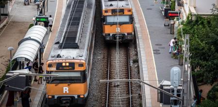 Trains on the Rodalies de Catalunya network, operated by Renfe Operadora SC, arrive into platforms at the Sant Pol de Mar railway station in the Sant Pol de Mar district of Barcelona, Spain