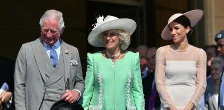 El rey Carlos III, la reina Camila y Meghan Markle en una imagen de archivo de 2018.