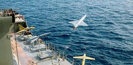 FILE - In this photo released by the Iranian Army on Aug. 25, 2022, a drone is launched from a warship in a military drone drill in Iran. The Iranian-made drones that Russia sent slamming into central Kyiv this week have produced hand-wringing and consternation in Israel, complicating the country’s balancing act between Russia and the West. (Iranian Army via AP)