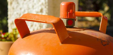 Traditional metal butane gas bottle at home in Spain