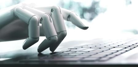 Robot concept or robot hand chatbot pressing computer keyboard enter