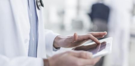 Doctor looking at a tablet