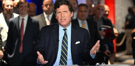 (FILES) In this file photo taken on November 17, 2022 Tucker Carlson speaks during 2022 FOX Nation Patriot Awards at Hard Rock Live at Seminole Hard Rock Hotel & Casino Hollywood in Hollywood, Florida. - Fox News star host Tucker Carlson is leaving the influential TV network, it was announced April 24, 2023, in a shock move days after the conservative outlet reached a $787.5 million settlement over a damaging defamation case. (Photo by Jason Koerner / GETTY IMAGES NORTH AMERICA / AFP)