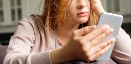 Upset girl with a phone