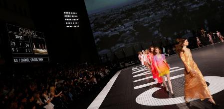 Models present designs for Los Angeles CHANEL Cruise 2023/24 show at Paramount Studios in Los Angeles, California on May 9, 2023. (Photo by Michael Tran / AFP)