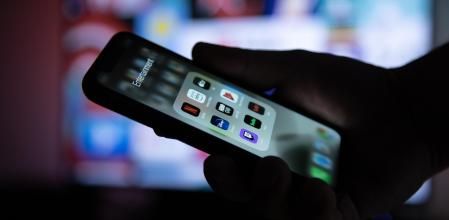 Mannheim - BW / Germany 11.17.2019: Apple XS Smartphone in Hand with Group of  Streaming Applications as Netflix, HBO, Disney Plus, Apple TV