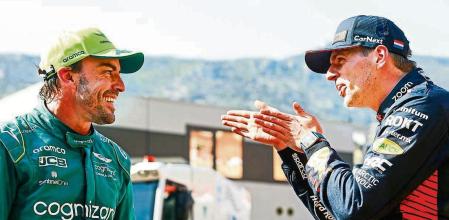 MONTE-CARLO, MONACO - MAY 27: Pole position qualifier Max Verstappen of the Netherlands and Oracle Red Bull Racing and Second placed qualifier Fernando Alonso of Spain and Aston Martin F1 Team talk in parc ferme during qualifying ahead of the F1 Grand Prix of Monaco at Circuit de Monaco on May 27, 2023 in Monte-Carlo, Monaco. (Photo by Mark Thompson/Getty Images)