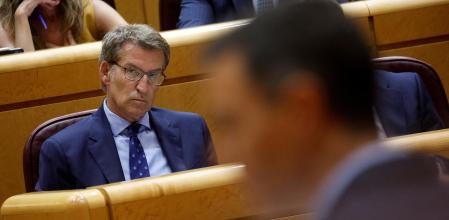 FILE PHOTO: Spain's opposition People's Party (PP) leader Alberto Nunez Feijoo listens to Spain's Prime Minister Pedro Sanchez speak during a session at the Spanish Senate in Madrid, Spain, September 6, 2022. REUTERS/Susana Vera/File Photo