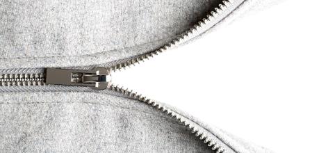 silver zip on woolen fabric, isolated on white background