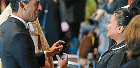 Prime Minister Rishi Sunak speaks to Nurse May Parsons at the NHS anniversary ceremony at Westminster Abbey, London, as part of the health service's 75th anniversary celebrations. Picture date: Wednesday July 5, 2023. Jordan Pettitt/Pool via REUTERS