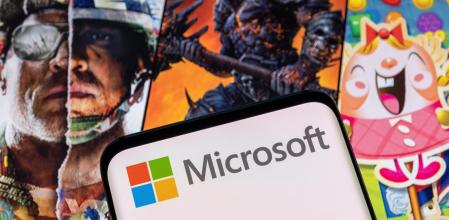 Microsoft logo is seen on a smartphone placed on displayed Activision Blizzard's games characters in this illustration taken January 18, 2022. REUTERS/Dado Ruvic/Illustration