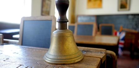 Old historical classroom with wooden desks and chalkboards