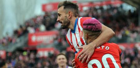 CORRECTION / TOPSHOT - Girona's Uruguayan forward #07 Cristhian Stuani and Girona's Brazilian defender #20 Yan Couto celebrate their team's second goal during the Spanish league football match between Girona FC and Valencia CF at the Montilivi stadium in Girona on December 1, 2023. (Photo by LLUIS GENE / AFP) / #{emoji}147;The erroneous mention[s] appearing in the metadata of this photo by LLUIS GENE has been modified in AFP systems in the following manner: [celebrate their team's second goal ] instead of [celebrate Valencia's Spanish defender #03 Cristhian Mosquera's owngoal ]. Please immediately remove the erroneous mention[s] from all your online services and delete it (them) from your servers. If you have been authorized by AFP to distribute it (them) to third parties, please ensure that the same actions are carried out by them. Failure to promptly comply with these instructions will entail liability on your part for any continued or post notification usage. Therefore we thank you very much for all your attention and prompt action. We are sorry for the inconvenience this notification may cause and remain at your disposal for any further information you may require.#{emoji}148;