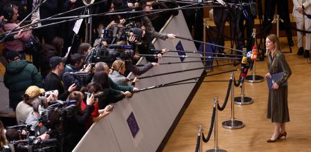 President of the European Parliament, Roberta Metsola (R) speaks to the press as she arrives to attend the EU-Western Balkans summit at the European headquarters in Brussels, on December 13, 2023. EU chief Ursula von der Leyen on December 13, 2023 urged the bloc's 27 leaders to back massive financial aid for Ukraine and Kyiv's ambitions for membership talks, ahead of a crunch summit. (Photo by KENZO TRIBOUILLARD / AFP)