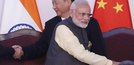 In this Oct. 16, 2016, file photo, Indian Prime Minister Narendra Modi, front and Chinese President Xi Jinping shake hands with leaders at the BRICS summit in Goa, India. Tensions along the China-India border high in the Himalayas have flared again in recent weeks. ÂIndian officials say the latest row began in early May when Chinese soldiers entered the Indian-controlled territory of Ladakh at three different points, erecting tents and guard posts. (AP Photo/Manish Swarup, File)