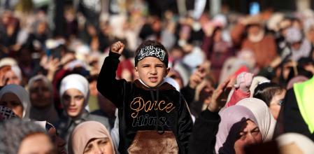 Palestinians attend a demonstration against the ongoing war between Israel and the Hamas movement and calling for 